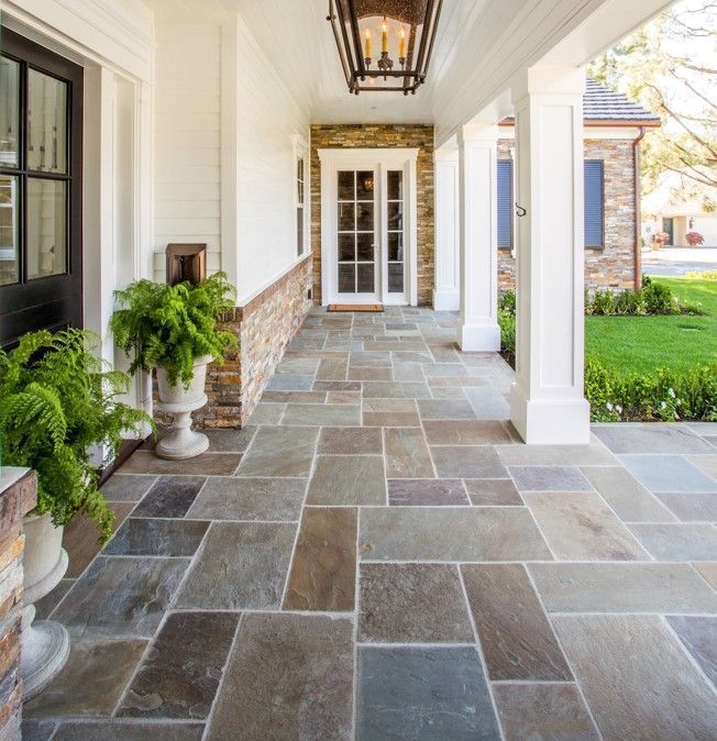 A stone walkway leading to the front door of a house