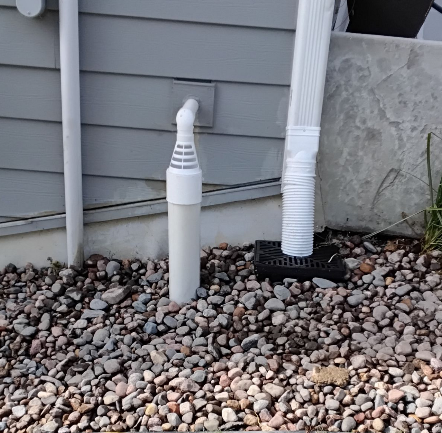 Underground sump pump discharge drainage pipe setup that includes tying in a downspout underground in as well in MN