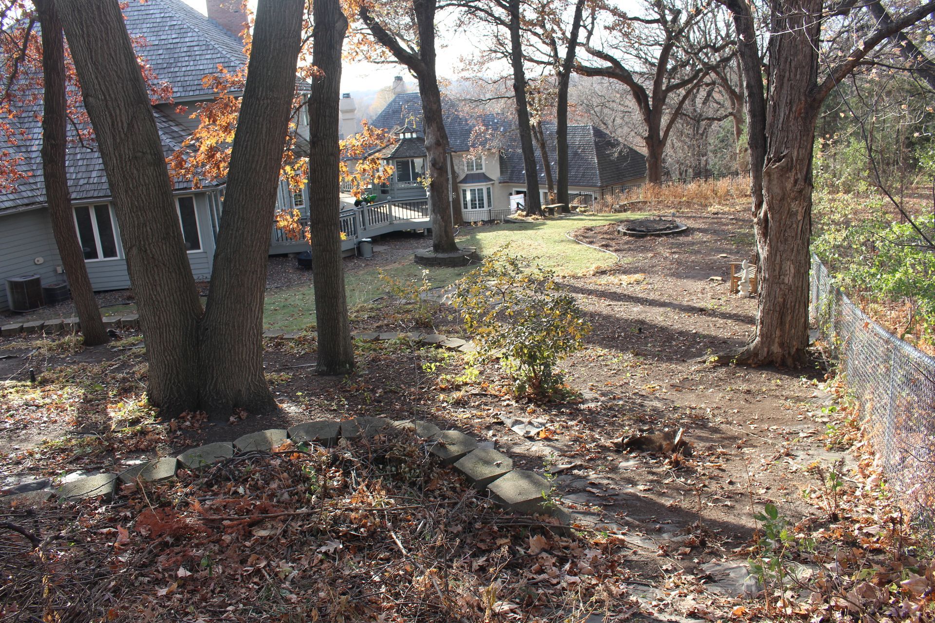 sloped backyard with no flat lawn and lots of useable space to work with