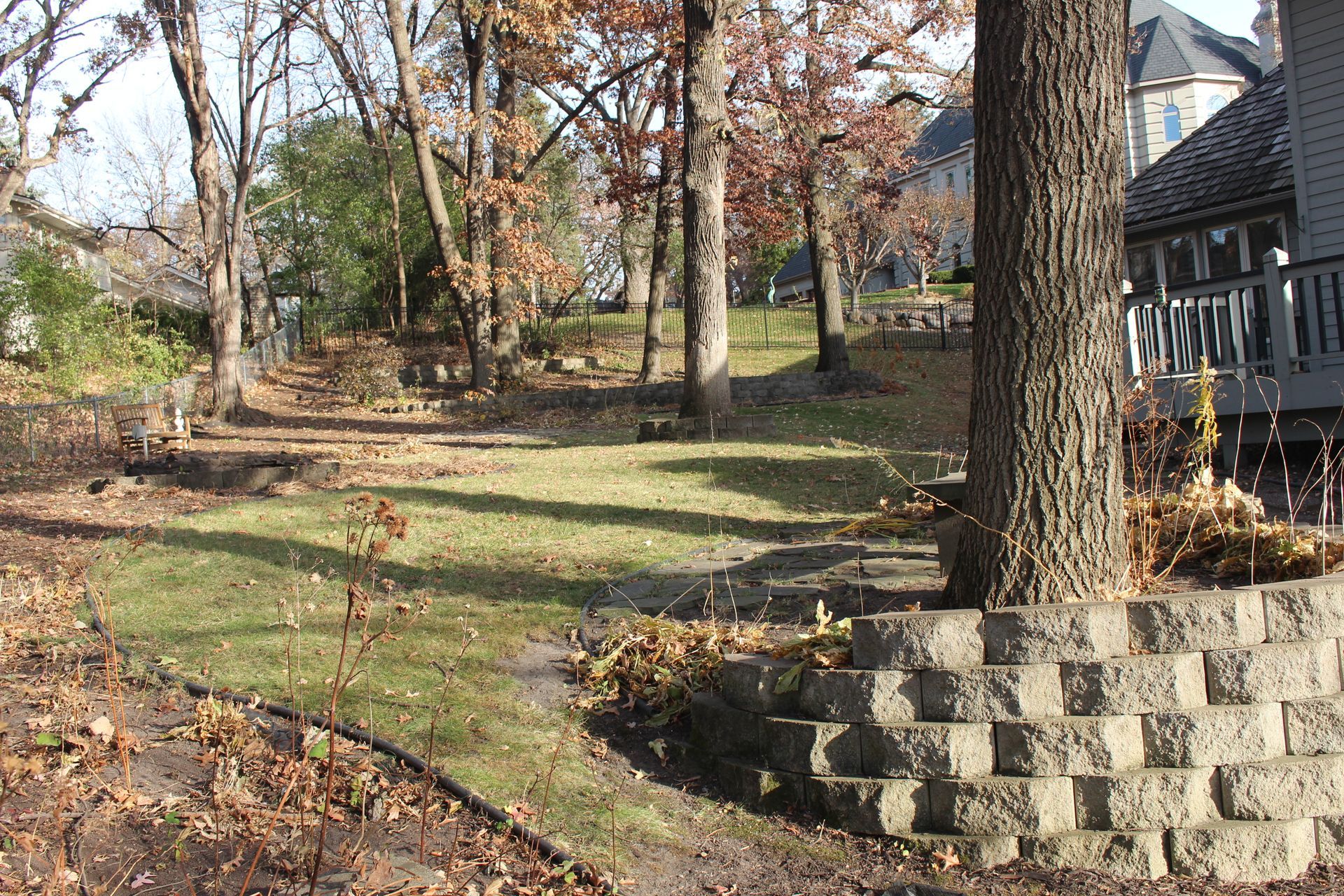 Sloped backyard with non-functional space for familiy to use. 