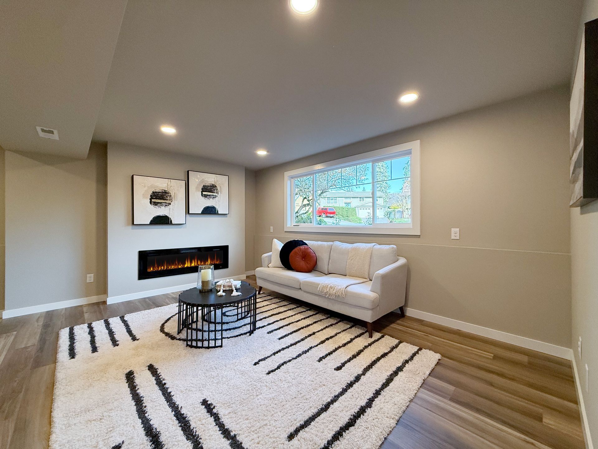 Bonus room with rug and sofa