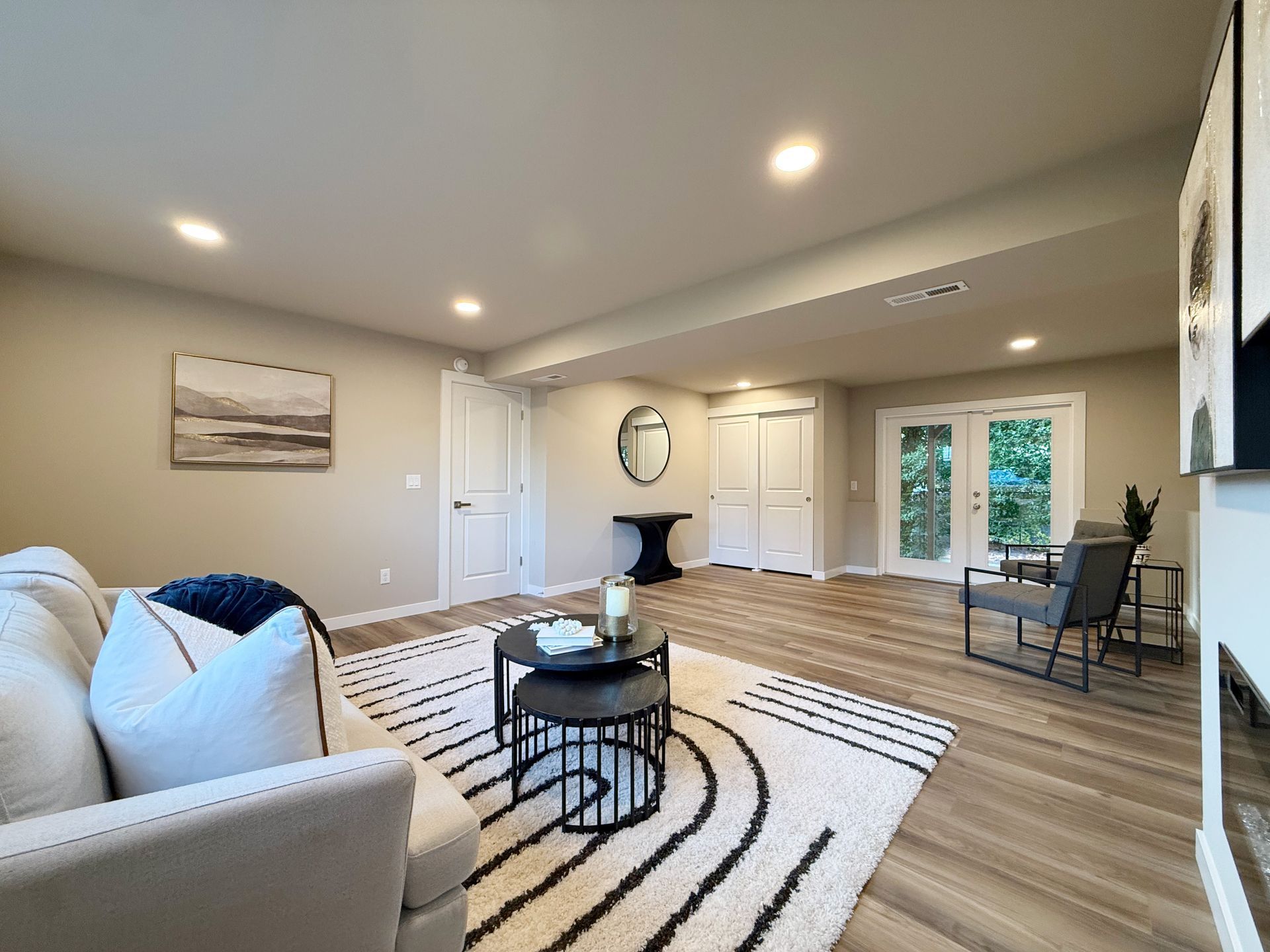 Bonus room with rug, sofa, furniture