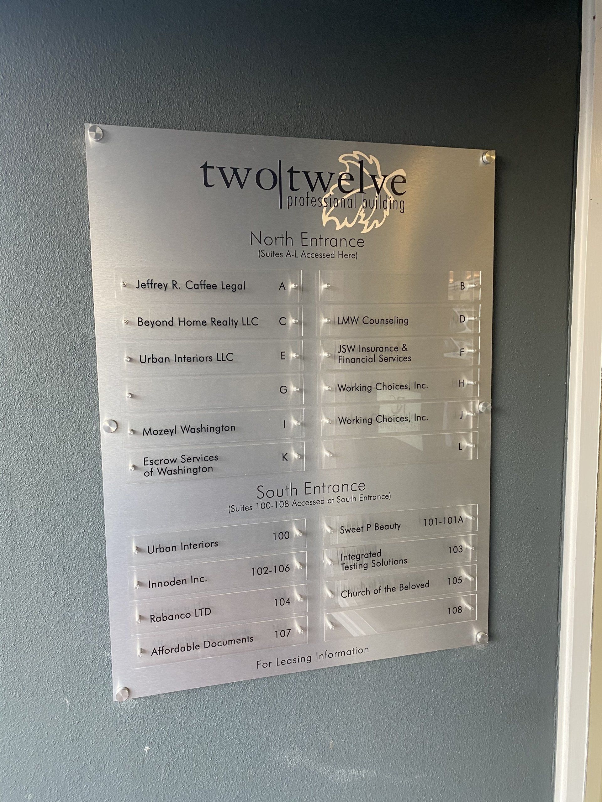 Sign on wall of 212 Wells Office Building in Renton WA