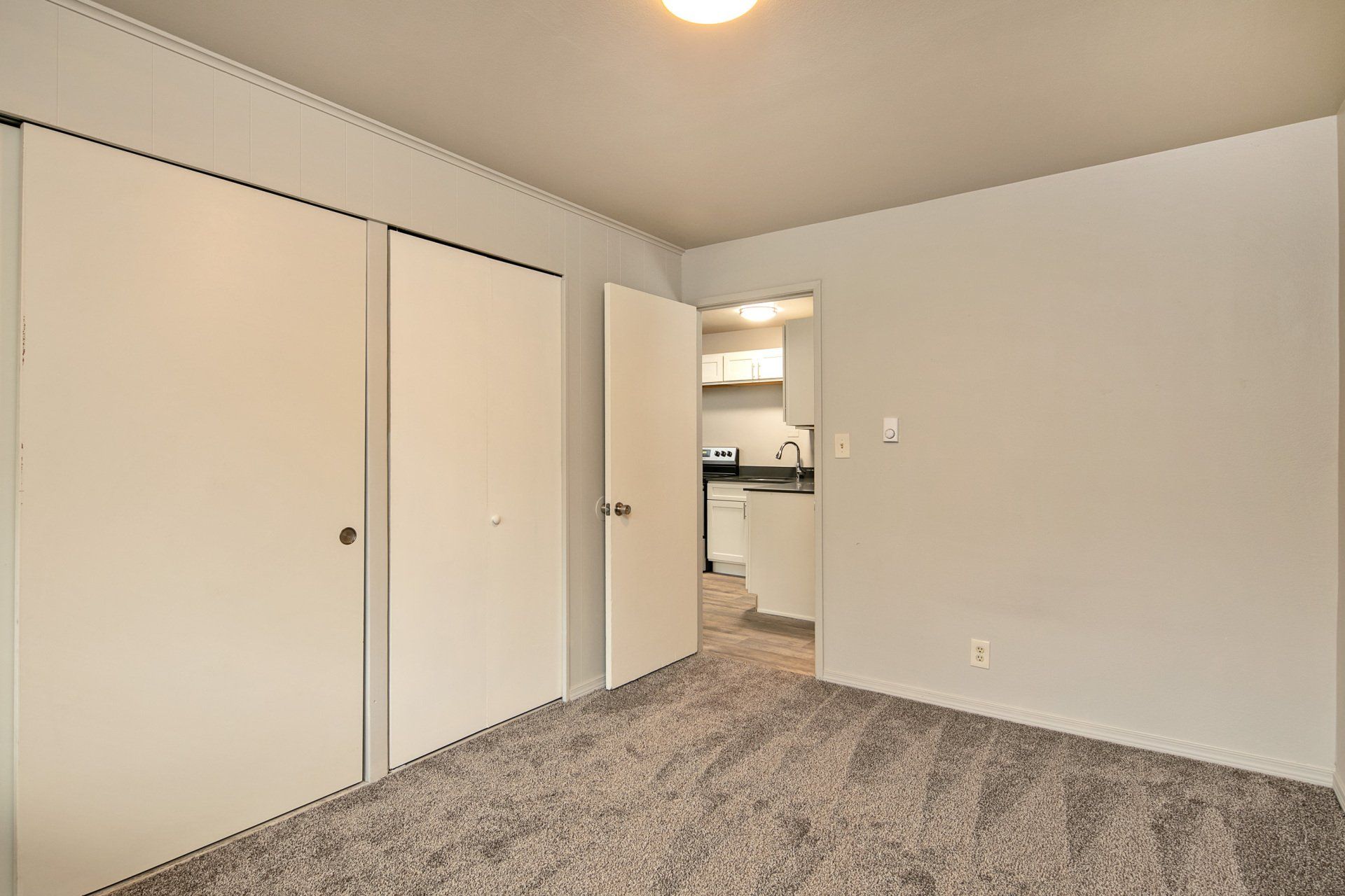 Cascade Court Apartment unit- bedroom looking into kitchen