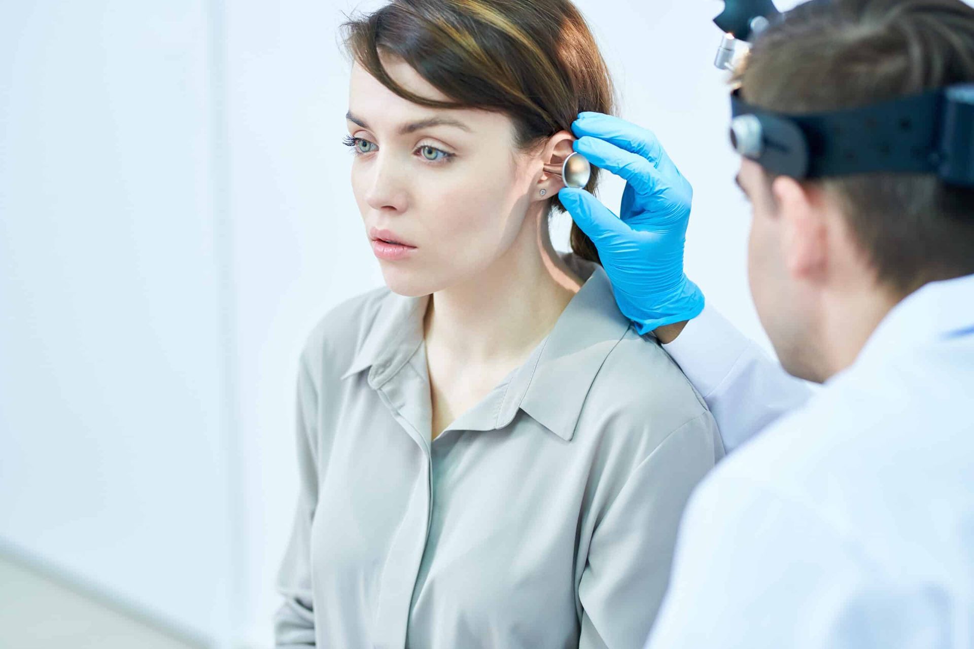 Doctor consulting with a parent and child in a clinic waiting room