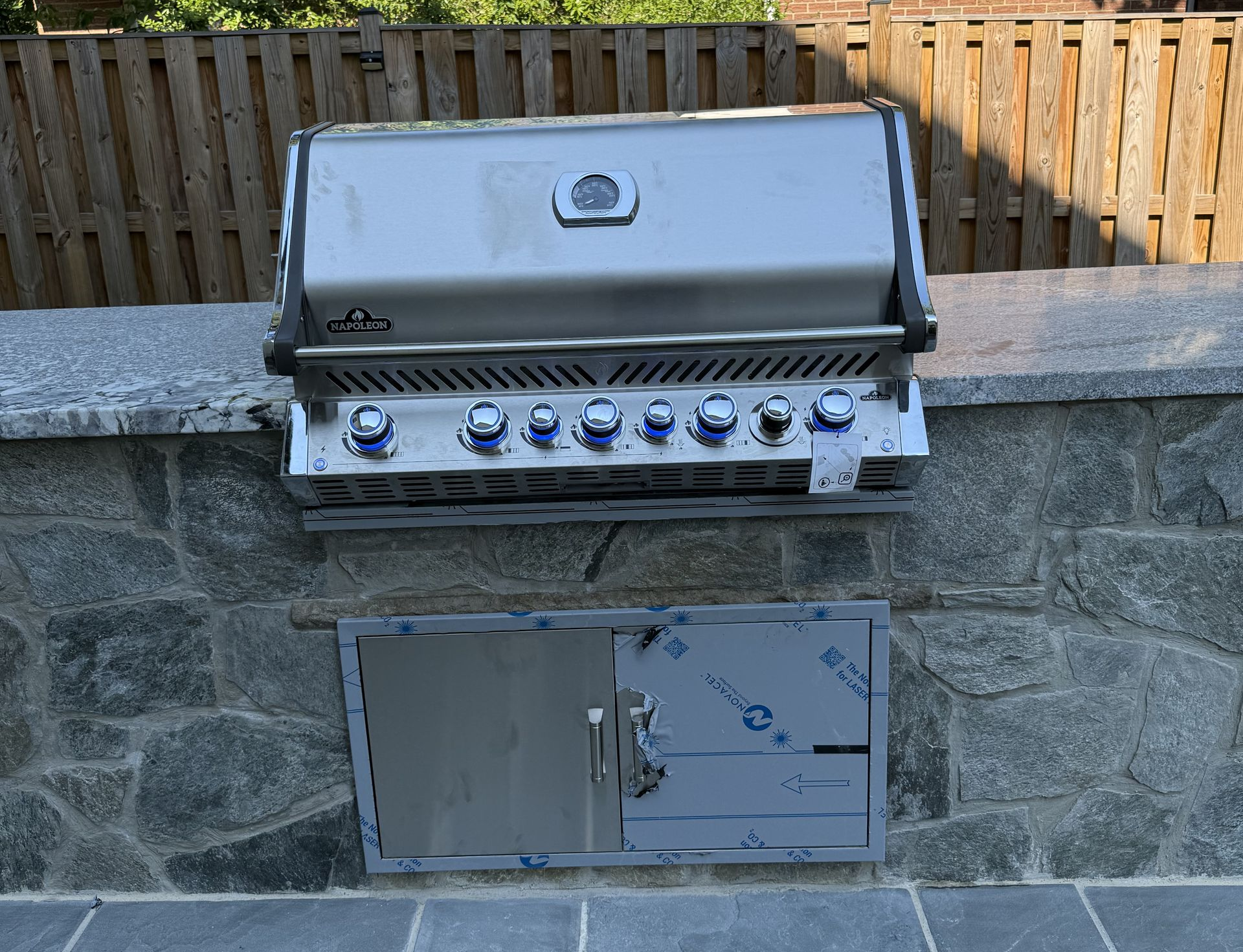 Stainless Steel Grill Built Into A Stone Wall With A Storage Compartment — Falls Church, VA — Nova Gas Stainless Steel Grill Built Into A Stone Wall With A Storage Compartment — Falls Church, VA — Nova Gas