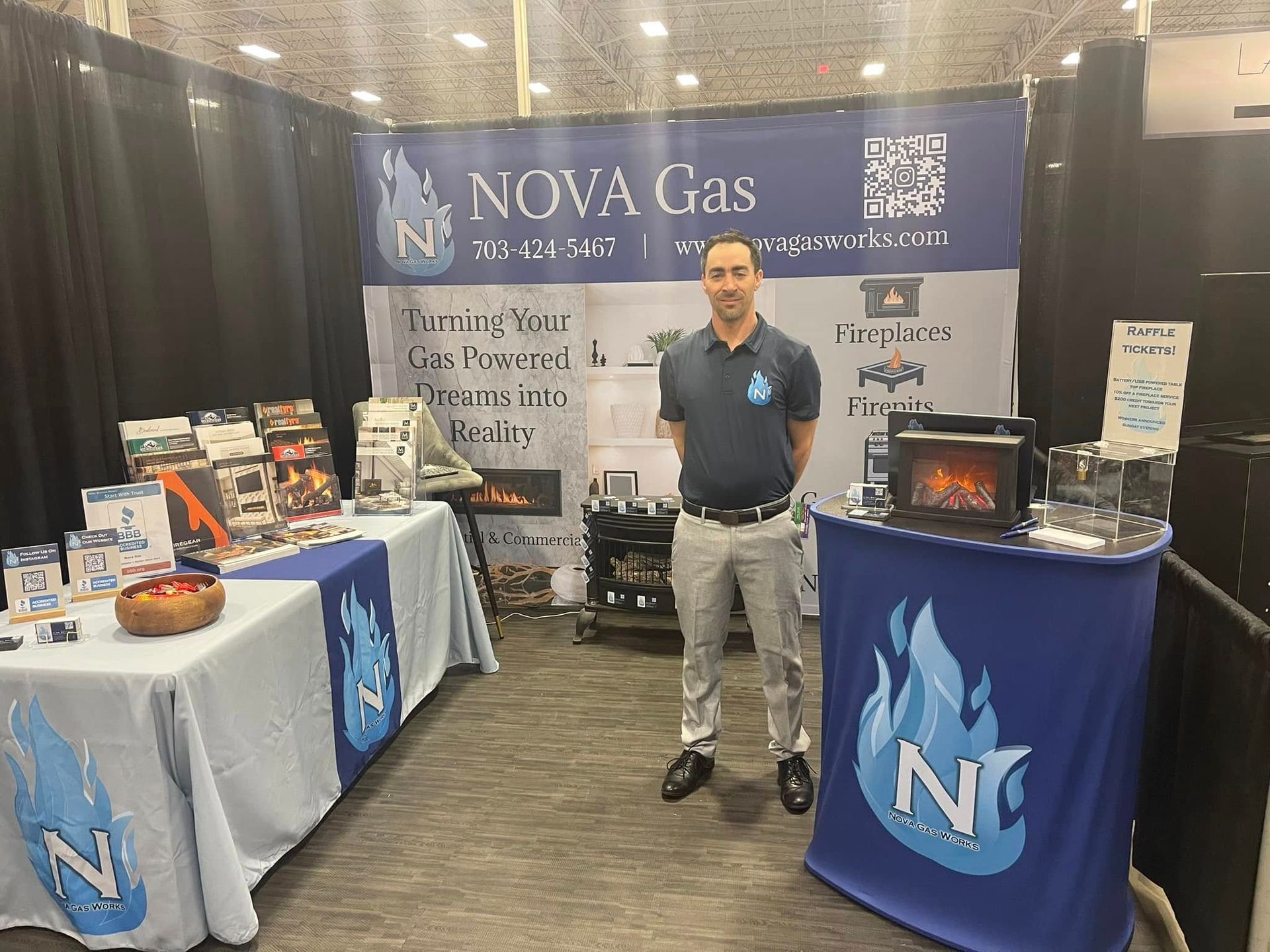 A person stands at a trade show booth for