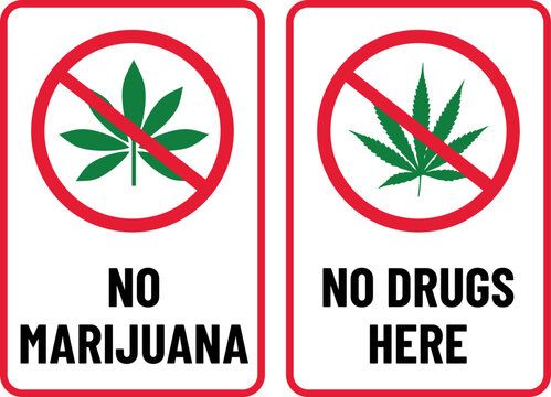 Two signs: a marijuana leaf with a red circle and slash, and text 