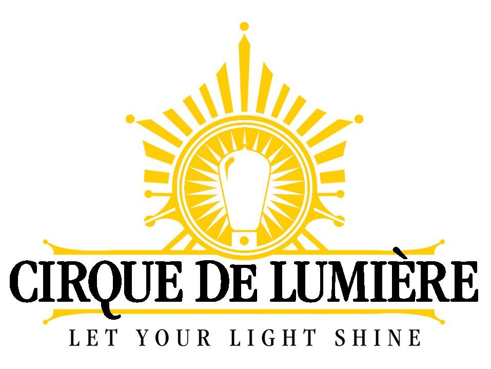 Logo for Cirque De Lumière with a gold sunburst design and a lightbulb in the center. The text reads