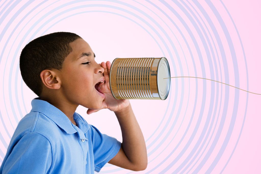 Boy yelling into a can phone with string, pink background with swirling lines.