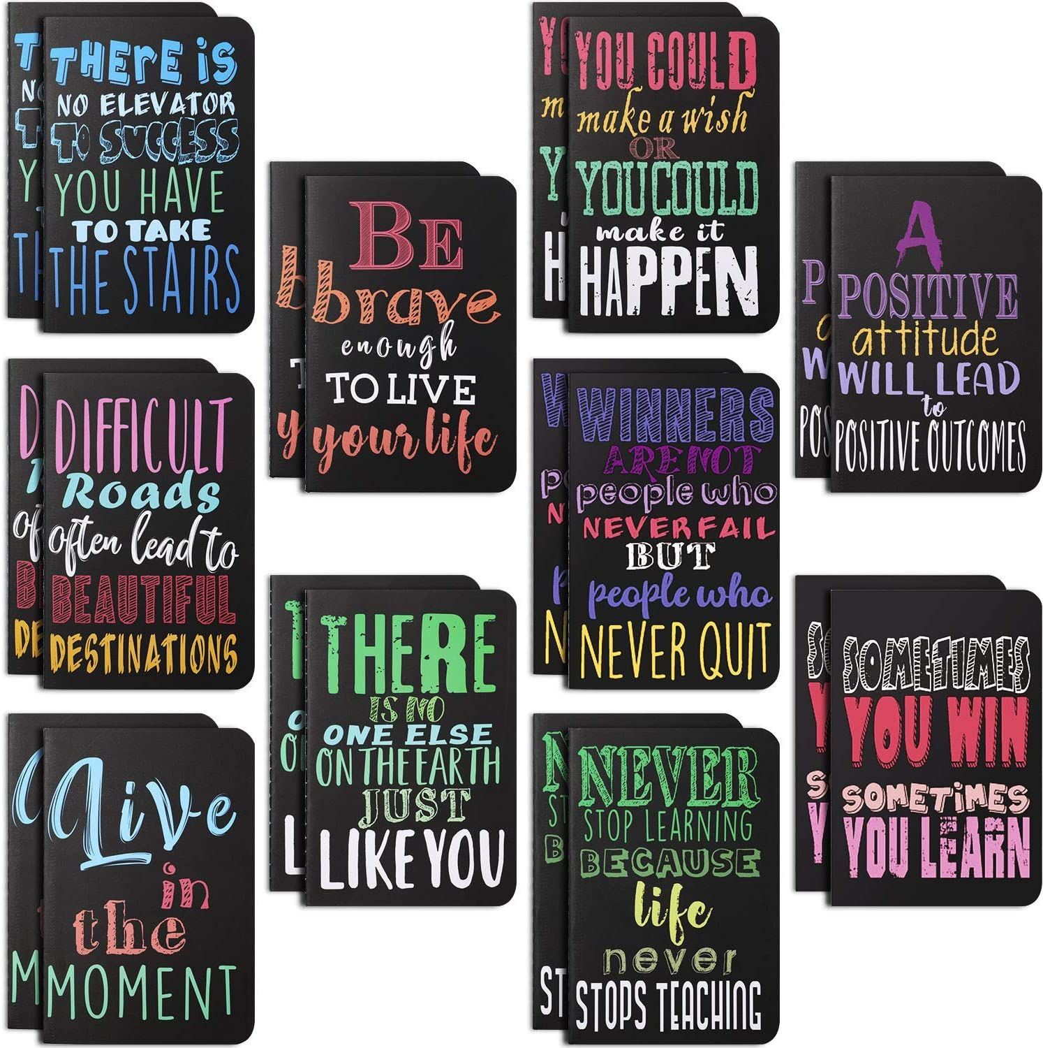Collection of black notebooks with colorful motivational quotes.