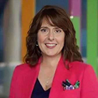 Woman with brown hair in a pink blazer smiles, colorful background.
