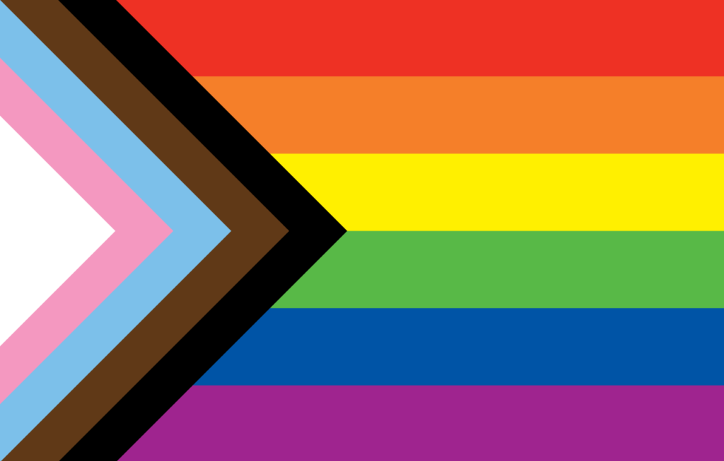 Pride flag with rainbow stripes, a black chevron, and colors for transgender and POC inclusion.