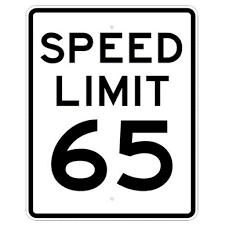 Speed limit sign: white background, black text reads