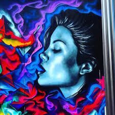 Woman's face in blue tones, exhaling colorful smoke. Bright reds, blues, and purples. Street art.