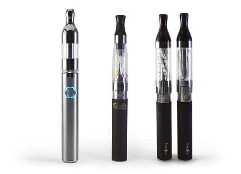 Four electronic cigarettes of varying designs against a white background.
