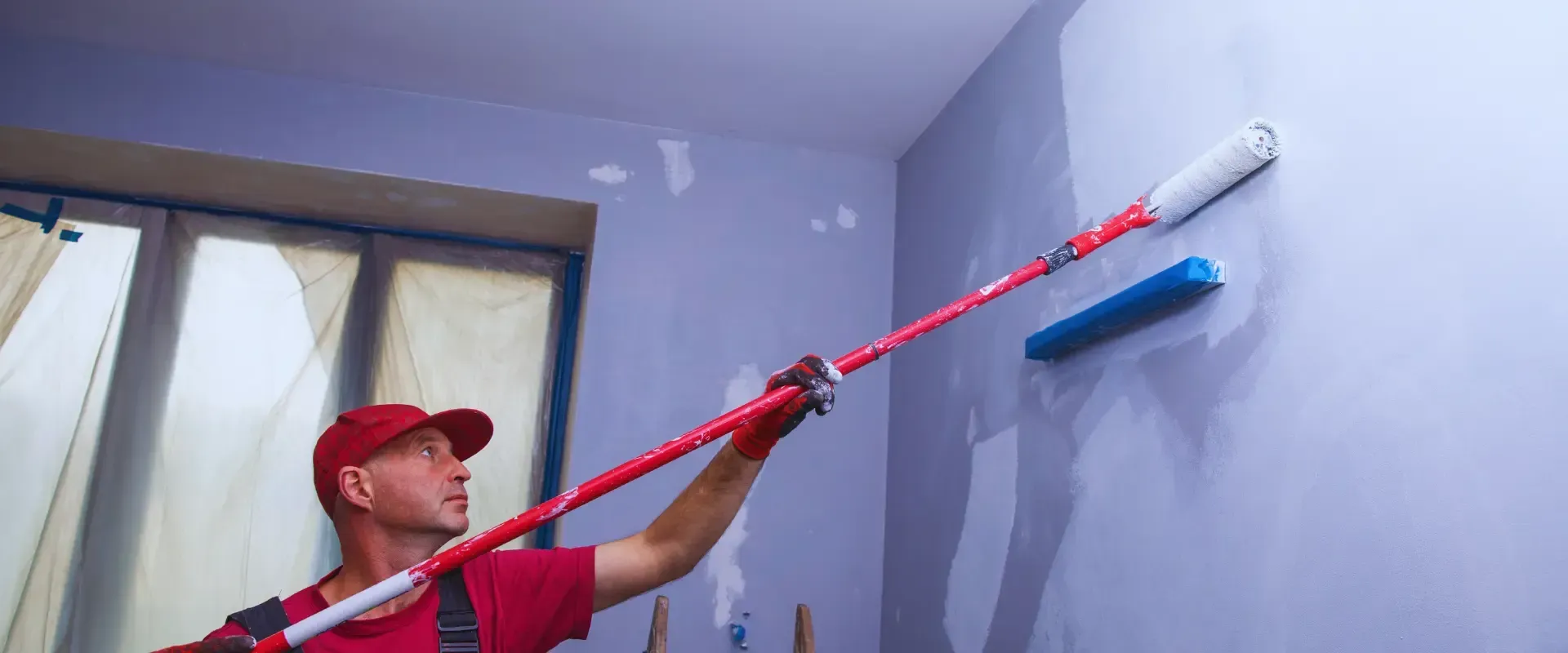 man doing wall paint