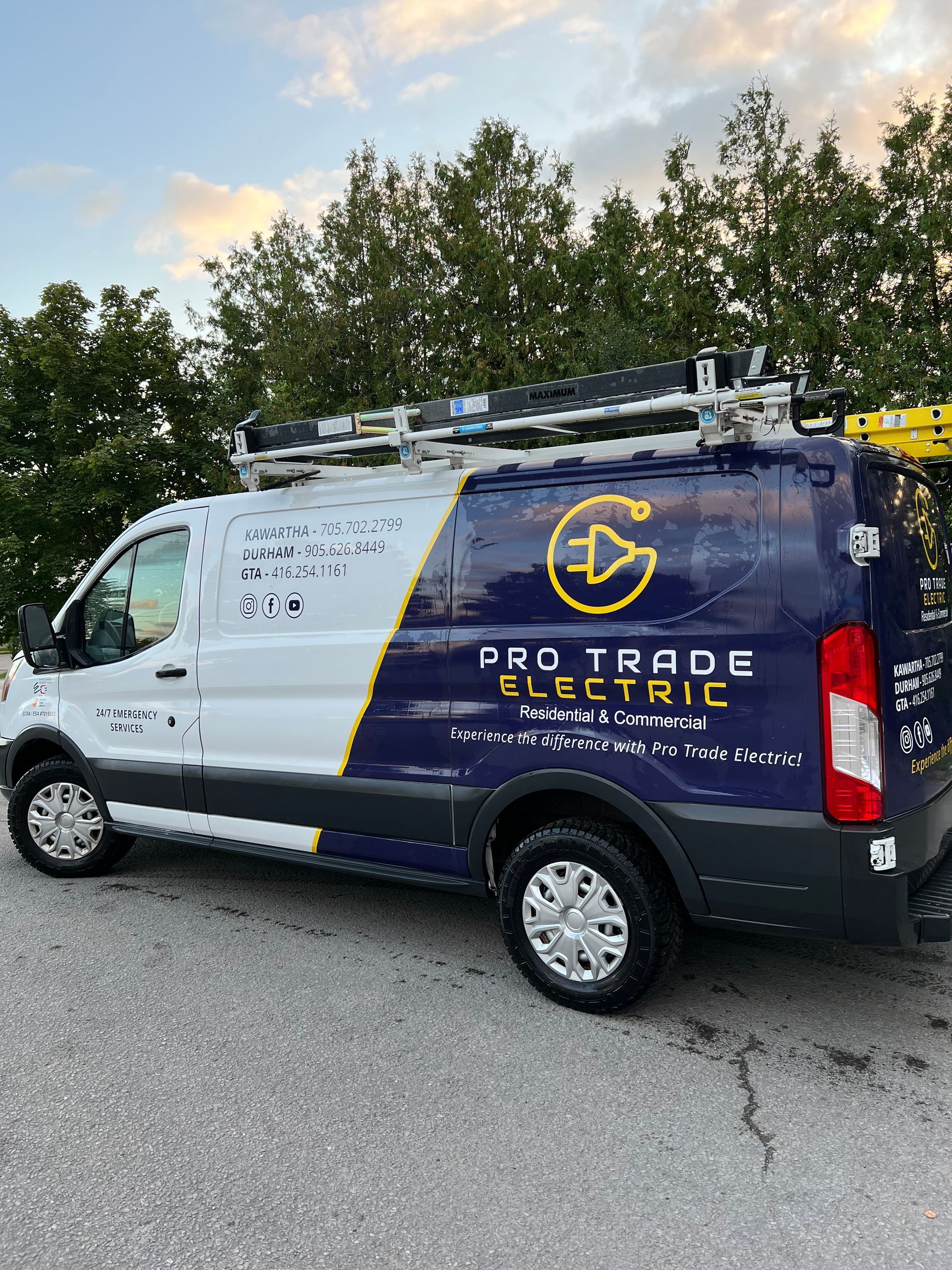 A pro trade electric van is parked in a parking lot.