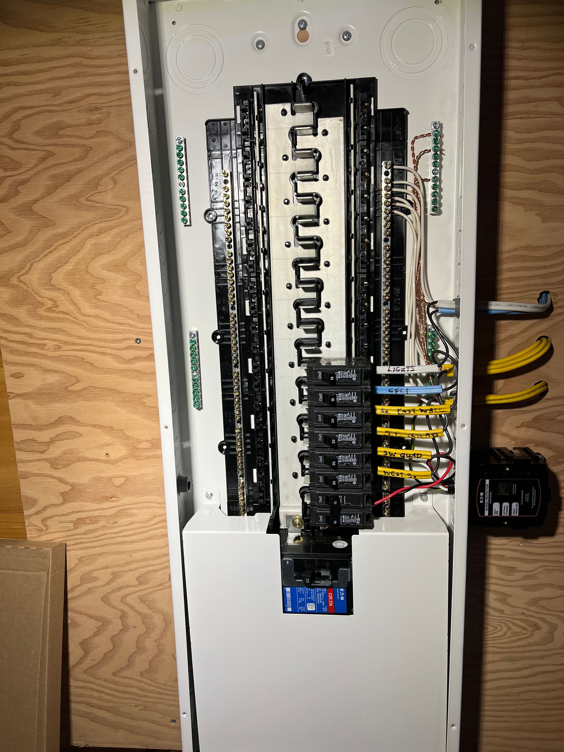 A white electrical box with a bunch of wires coming out of it