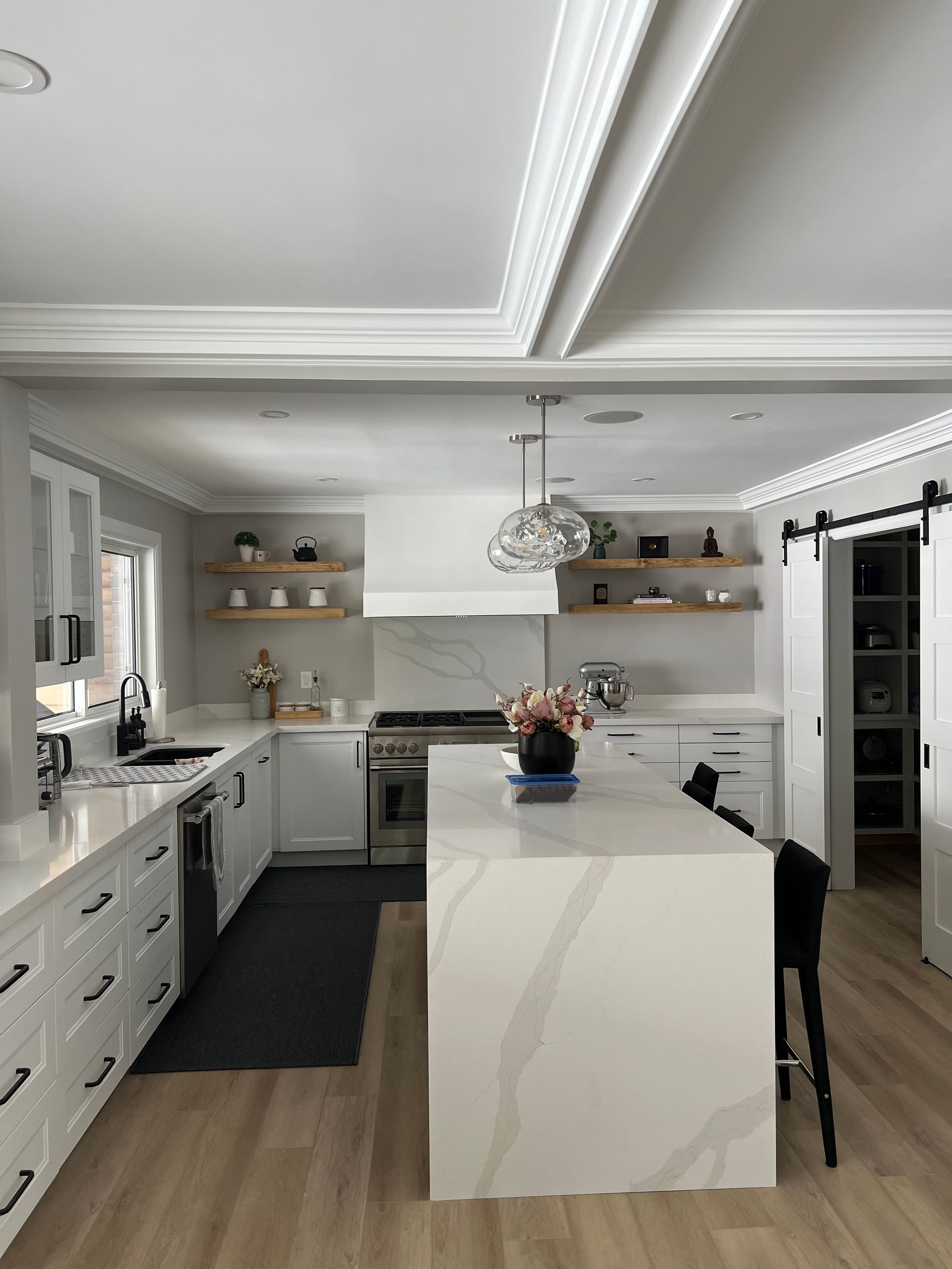 There is a large island in the middle of the kitchen.