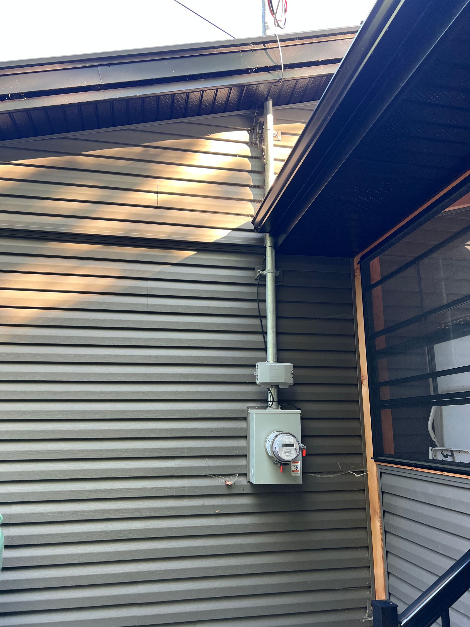 A house with a meter on the side of it