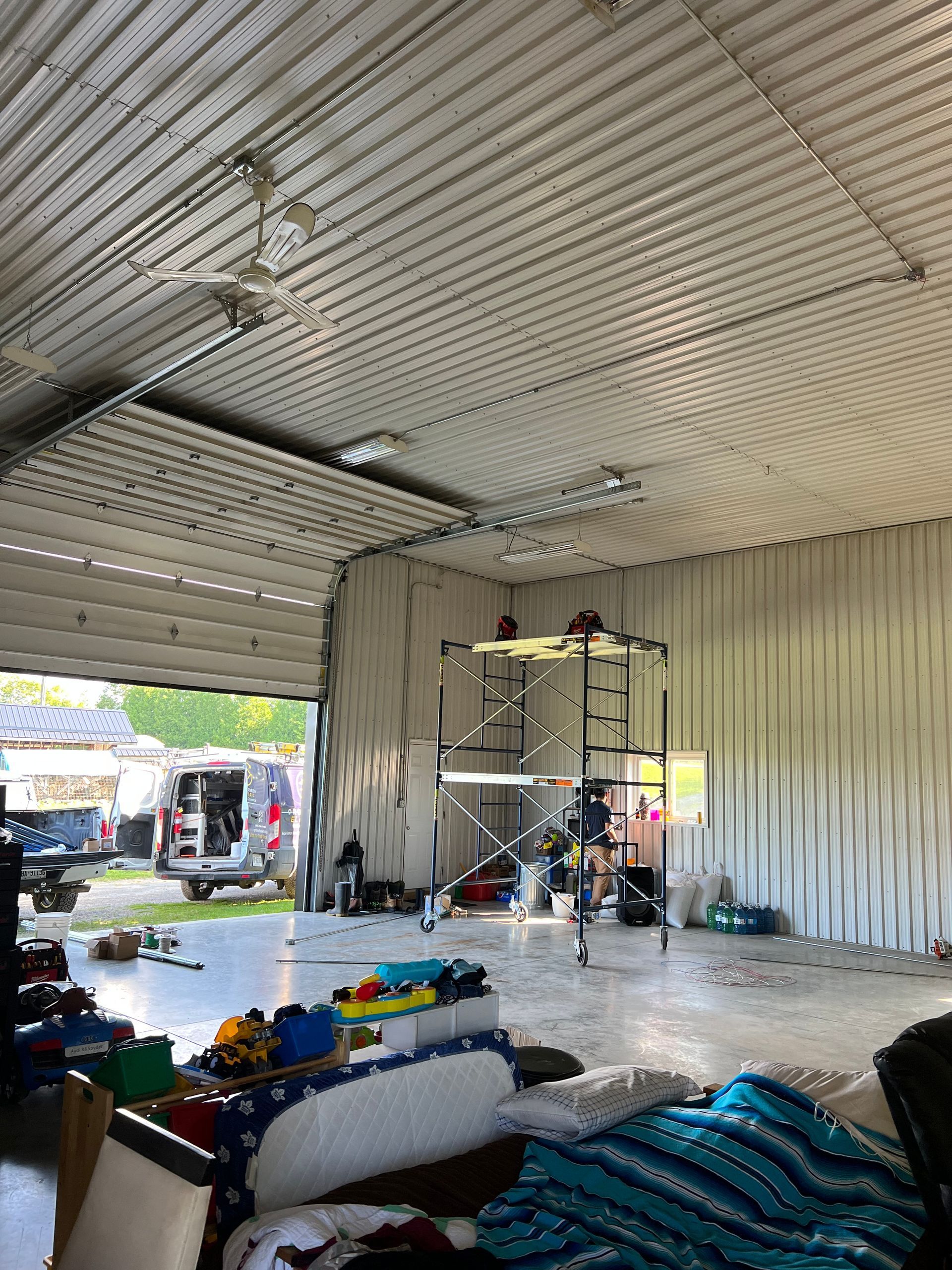 A large garage with a scaffolding in the middle of it.