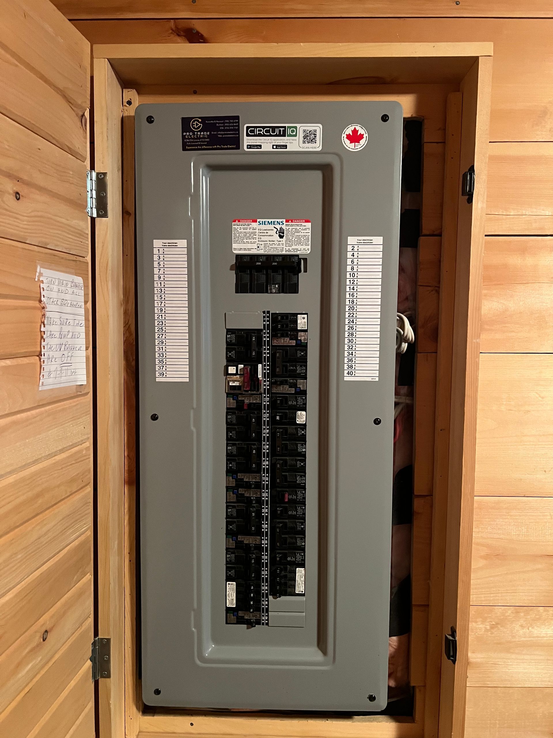 A large electrical box is sitting inside of a wooden box.