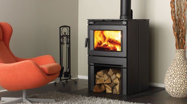 Medium wooden stove in front of seat — Freehold, NJ — Fireside Pros