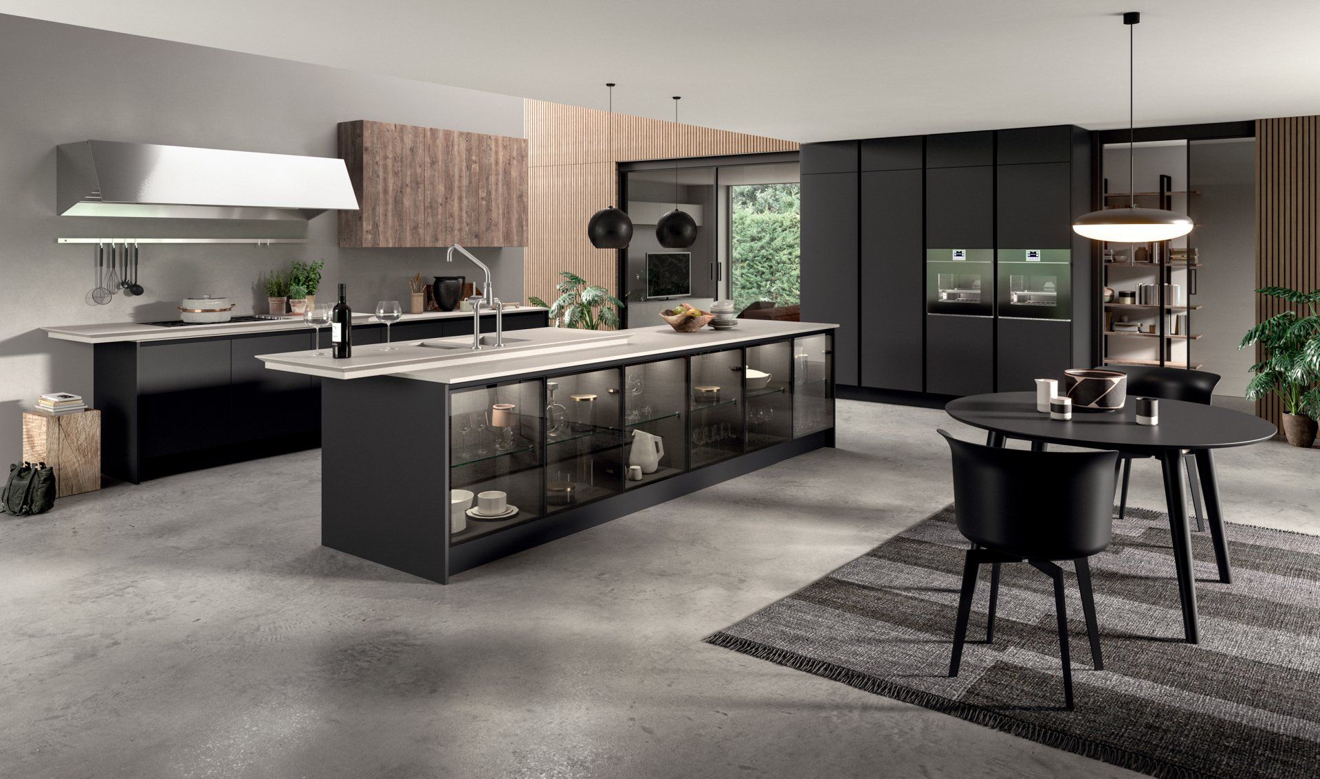 Cucina moderna Aran con mobili neri, ripiani grigi, isola con vetrina e zona pranzo.