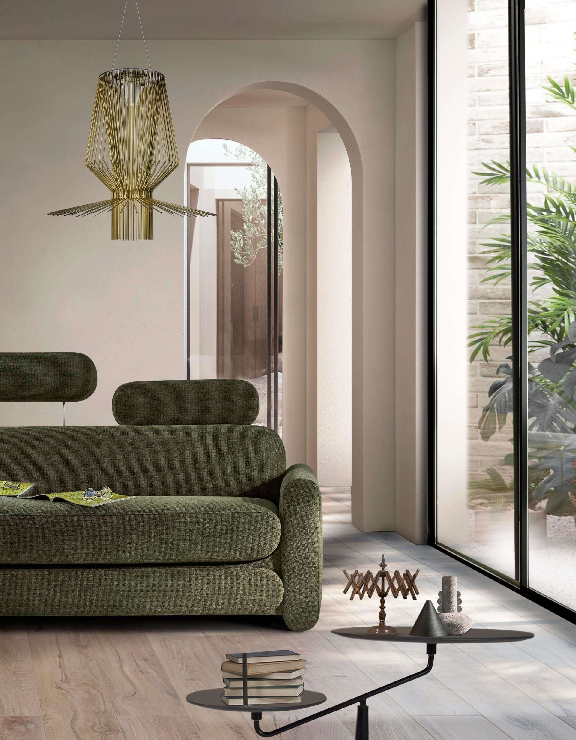 Divano verde in un luminoso e moderno soggiorno con porte ad arco e una grande finestra.