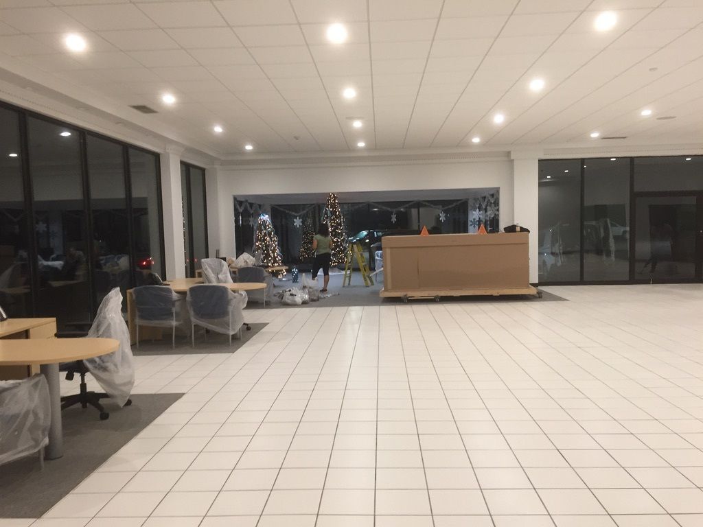 There is a christmas tree in the middle of the room.