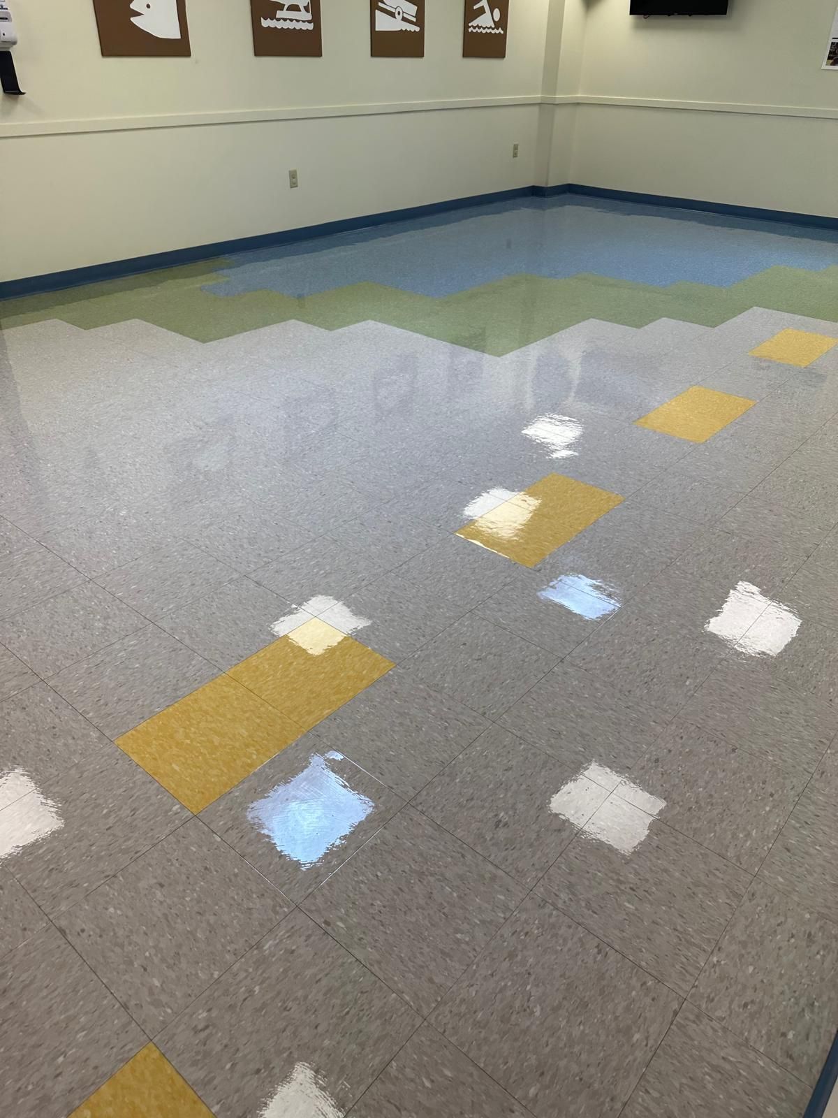 A room with a tiled floor and a lot of lights on it.