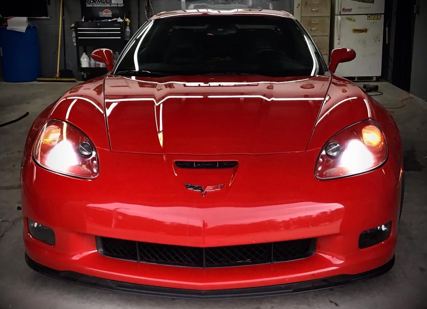 Red Corvette with gloss PPF finish showing high-shine paint protection