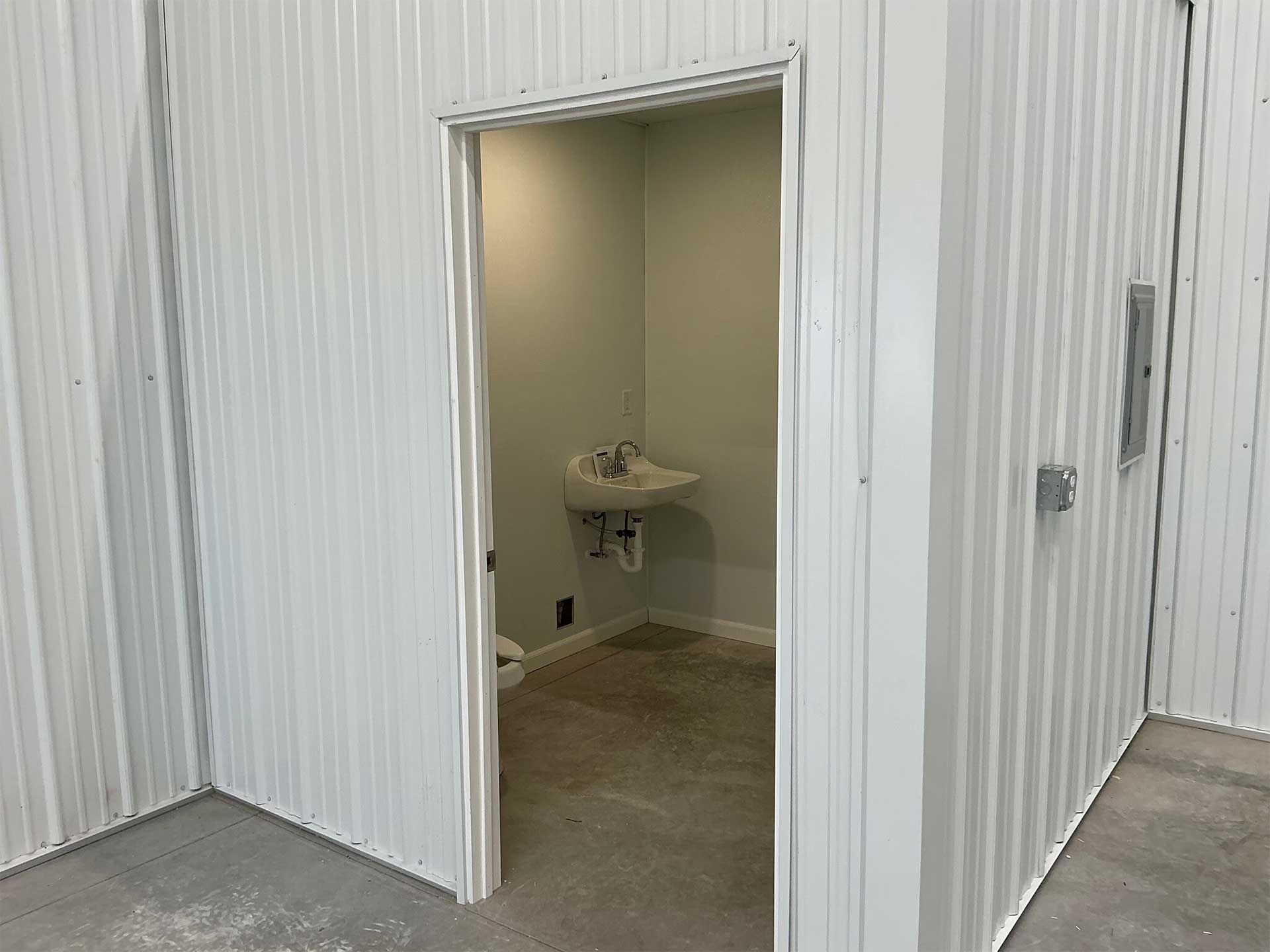 Open doorway to a small beige room