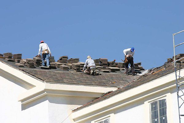 Roofer Installing New Roof — Etowah, NC — John Balken Jr. Roofing Company Roofer Installing New Roof — Etowah, NC — John Balken Jr. Roofing Company