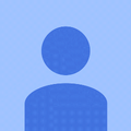 Blue silhouette of a person, head is a circle and body is a curved shape.