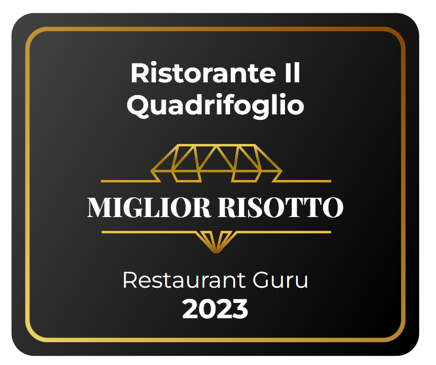 Award badge for Ristorante Il Quadrifoglio: “Miglior Risotto” from Restaurant Guru 2023 on black and gold background
