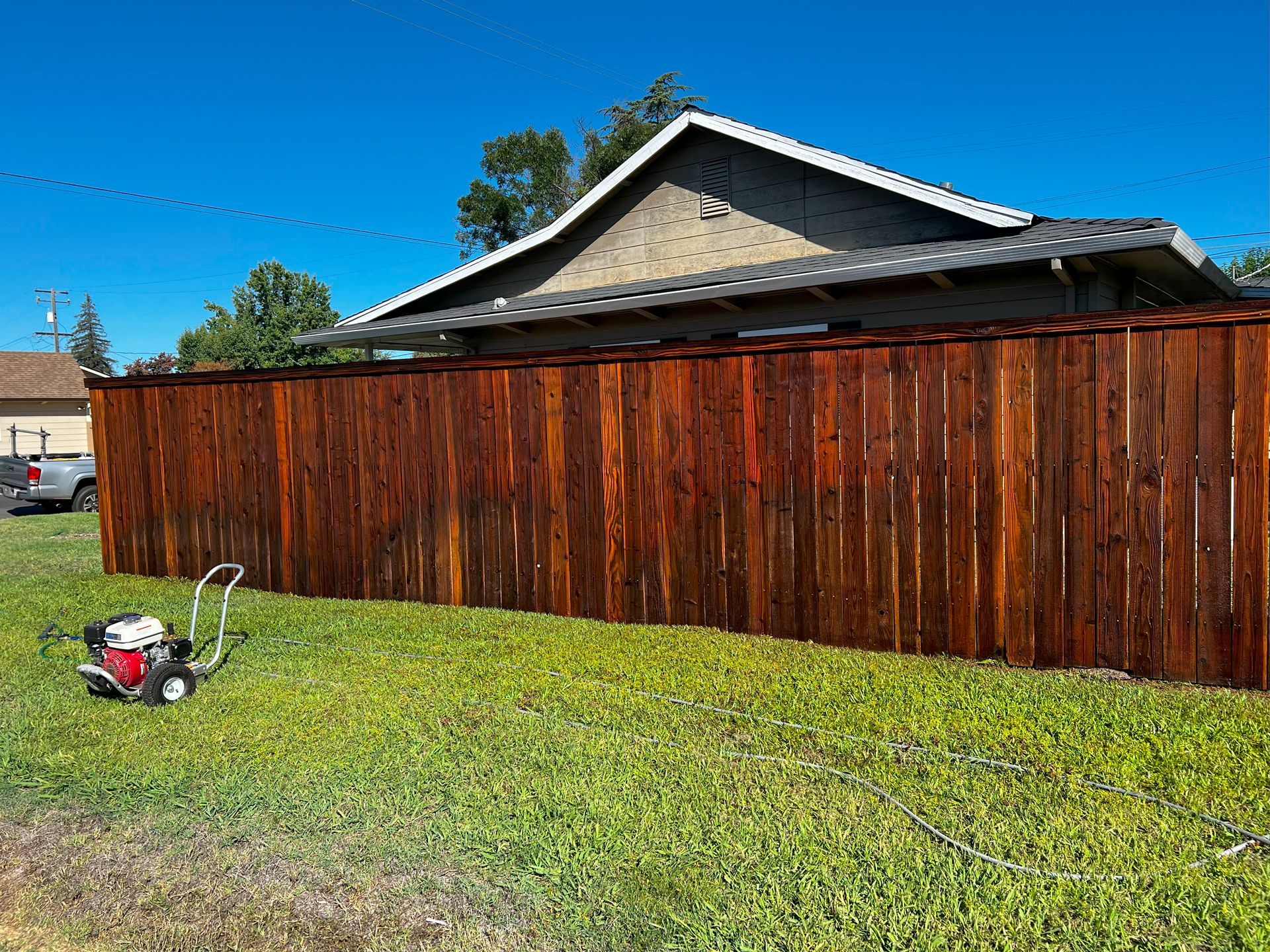 Wooden Fence With Green Lawn