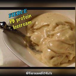A bowl of ice cream with a spoon in it.