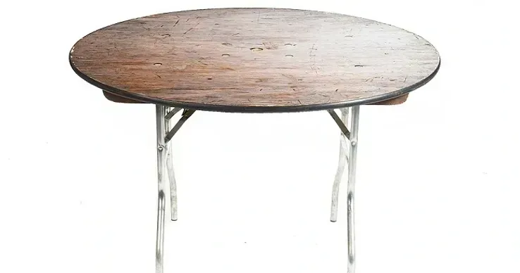 Round wooden folding table with metal legs on a white background