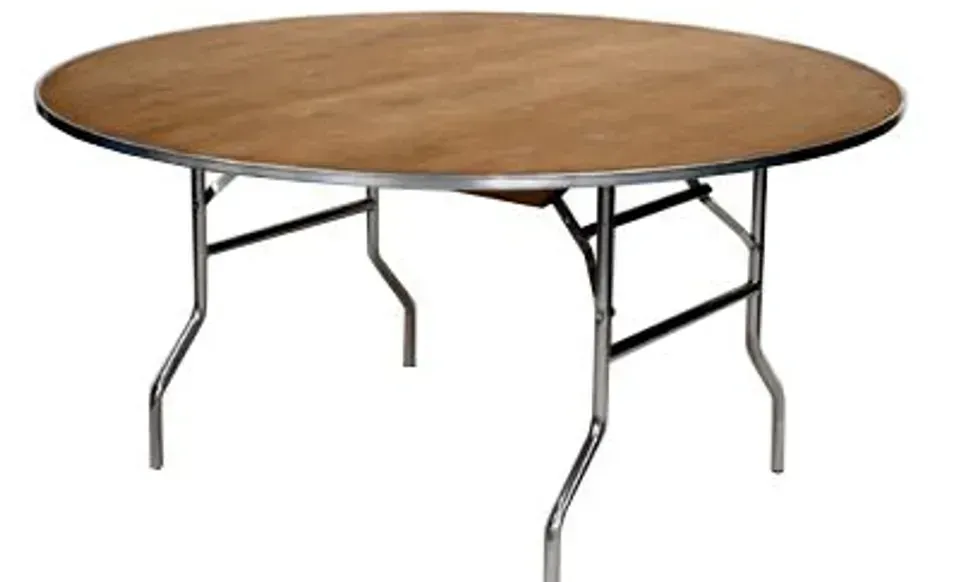 Round wooden folding table with metal legs on a white background