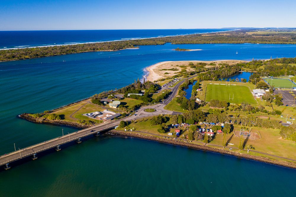 An Aerial View of a Bridge Over a Body of Water — Leonard Gray Roof Tiling In Ballina, NSW
