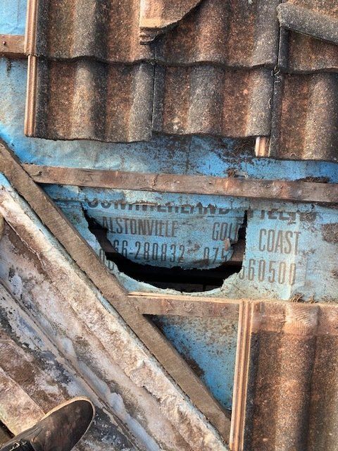 Roof Sarking Repairs with hole — Leonard Gray Roof Tiling In Goonellabah, NSW