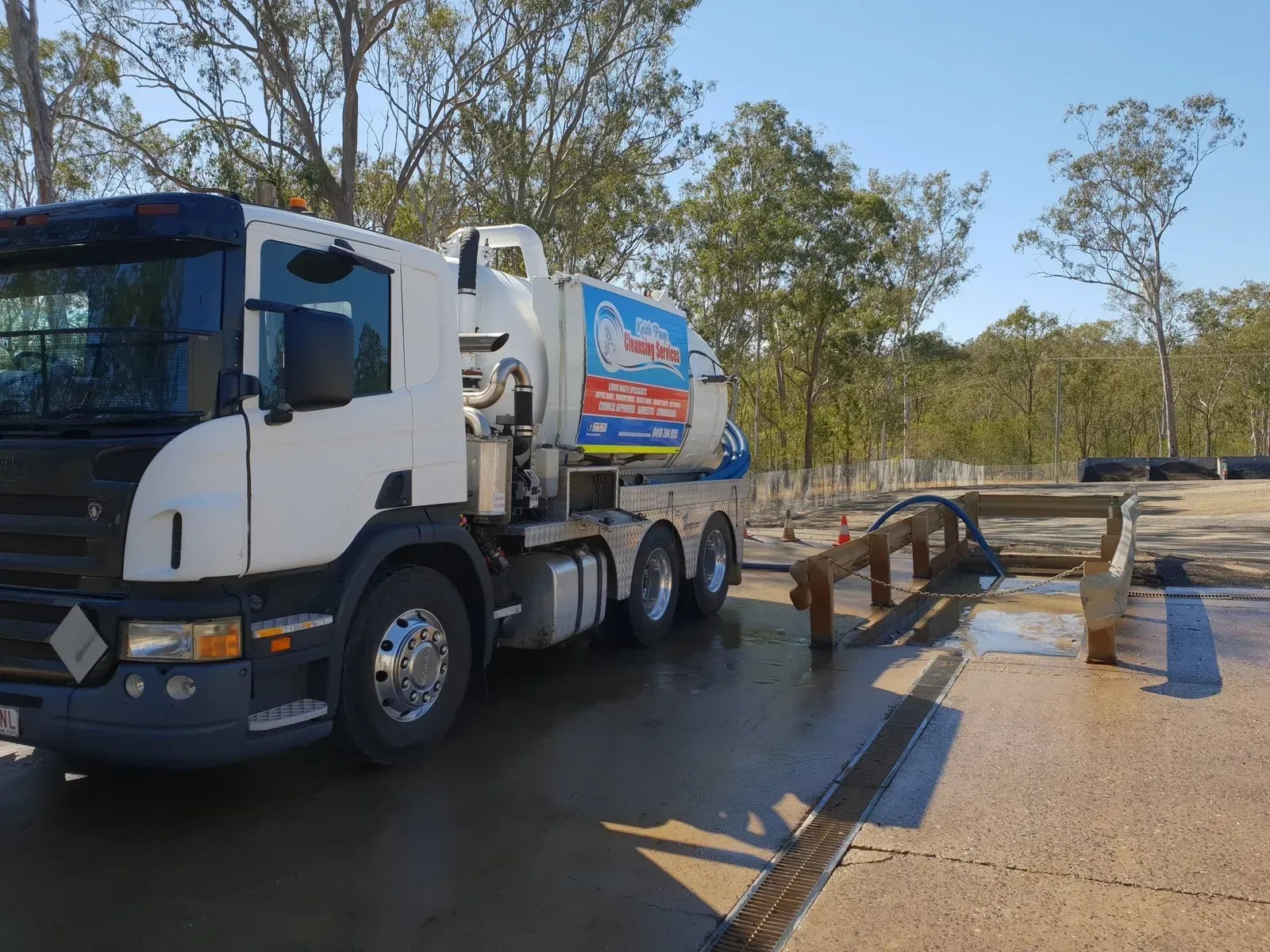 White Septic Truck Parked on a Concrete Pad — Paap's Cleansing Services in Branyan, QLD
