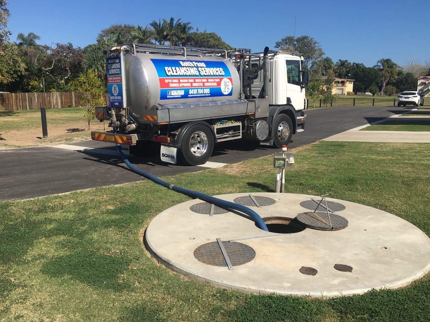 Septic Tank Pumping Truck With Hose — Paap's Cleansing Services in Childers, QLD