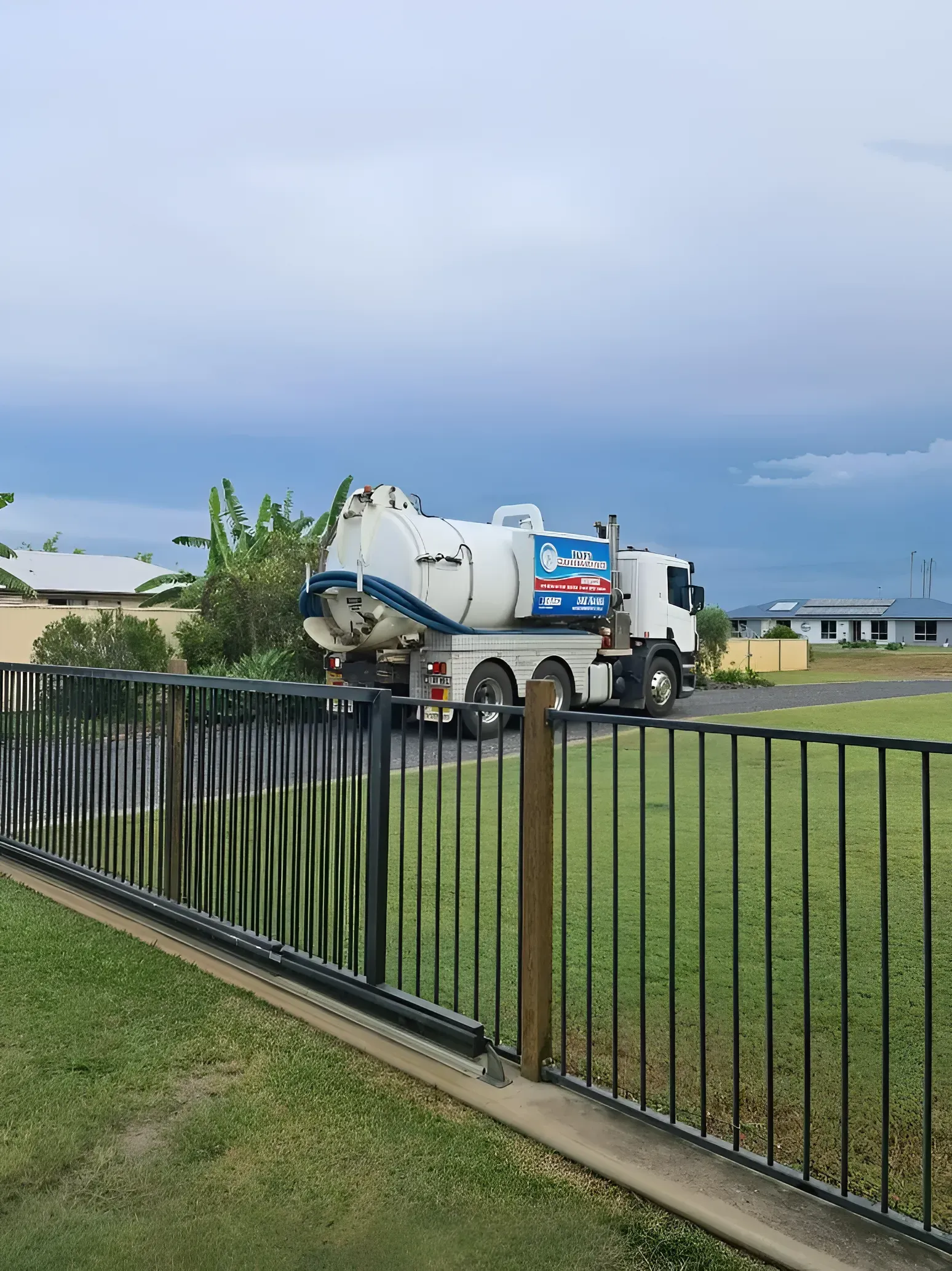 Septic Tank Truck Parked in Front Yard — Paap's Cleansing Services in Bargara, QLD