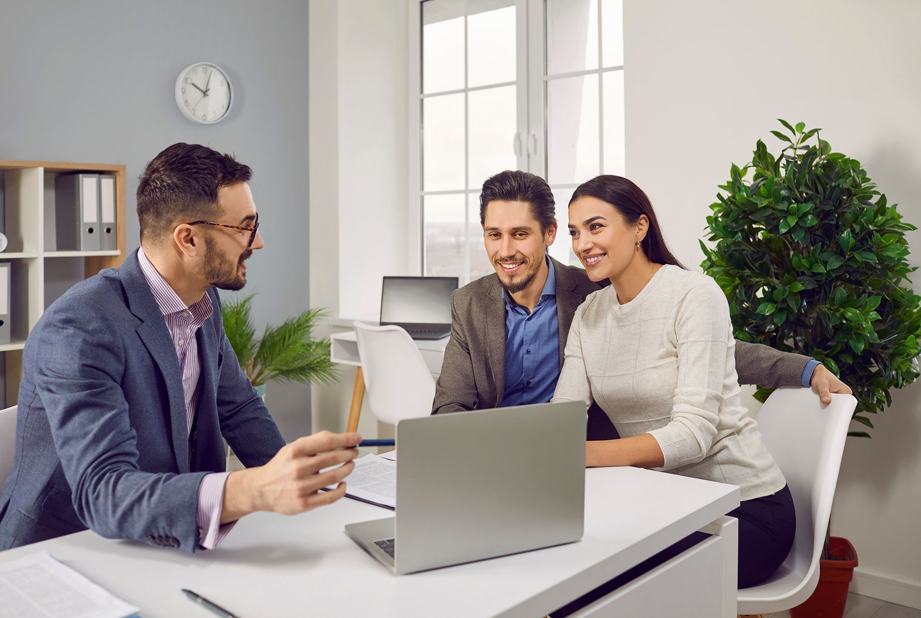 Couple Discussing Insurance With Their Agent