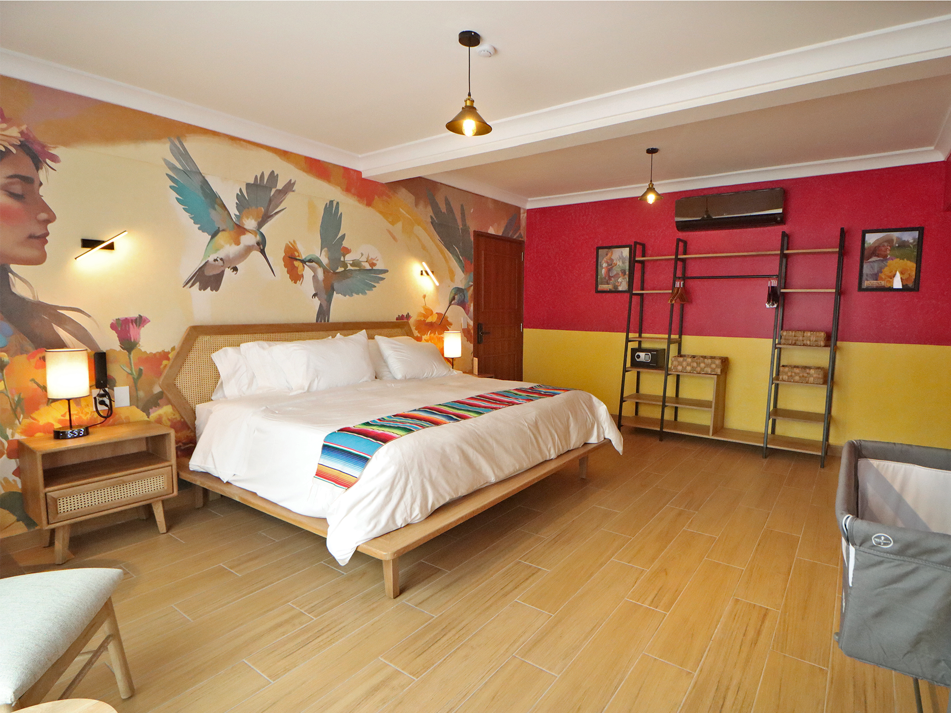 Un dormitorio con una cama y cuadros en la pared.