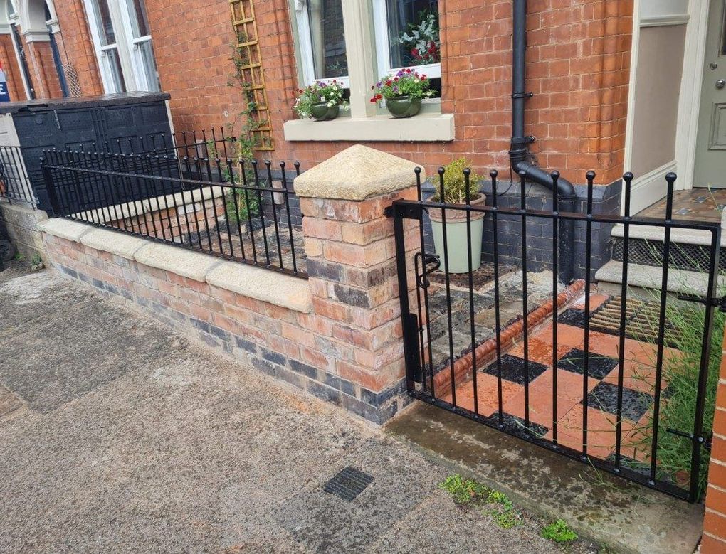 Black ball-top railings and a matching gate fitted on the front garden wall of a Victorian terrace in Derby