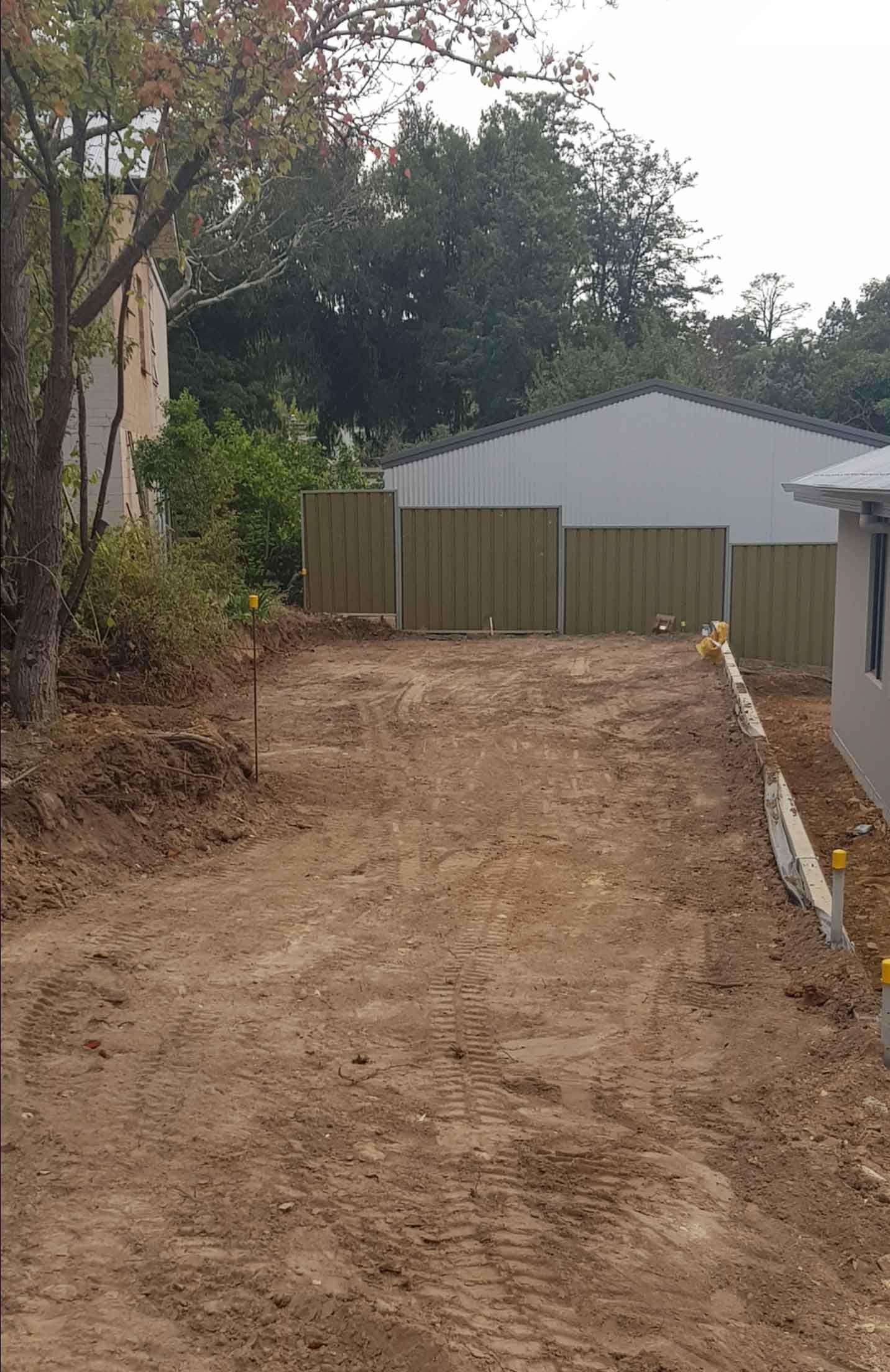 A Dirt Road Leading To A House With A Fence In The Background — Blackwood SA — Blackwood Earthmoving